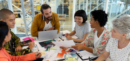 Side view of diverse business people discussing in the meeting at conference room in office