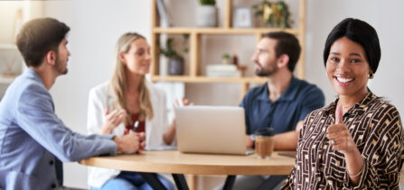 Thumbs up, thank you and business woman in company success meeting happy about startup growth. Port.