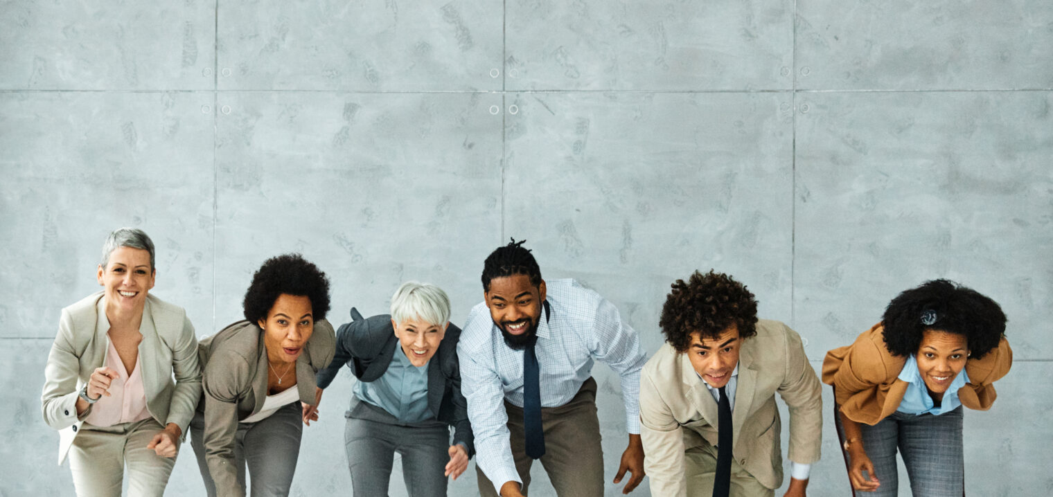 young business people meeting office teamwork group fun competition sports race break speed winner victory finish colleague win success run runner businesswoman senior mature