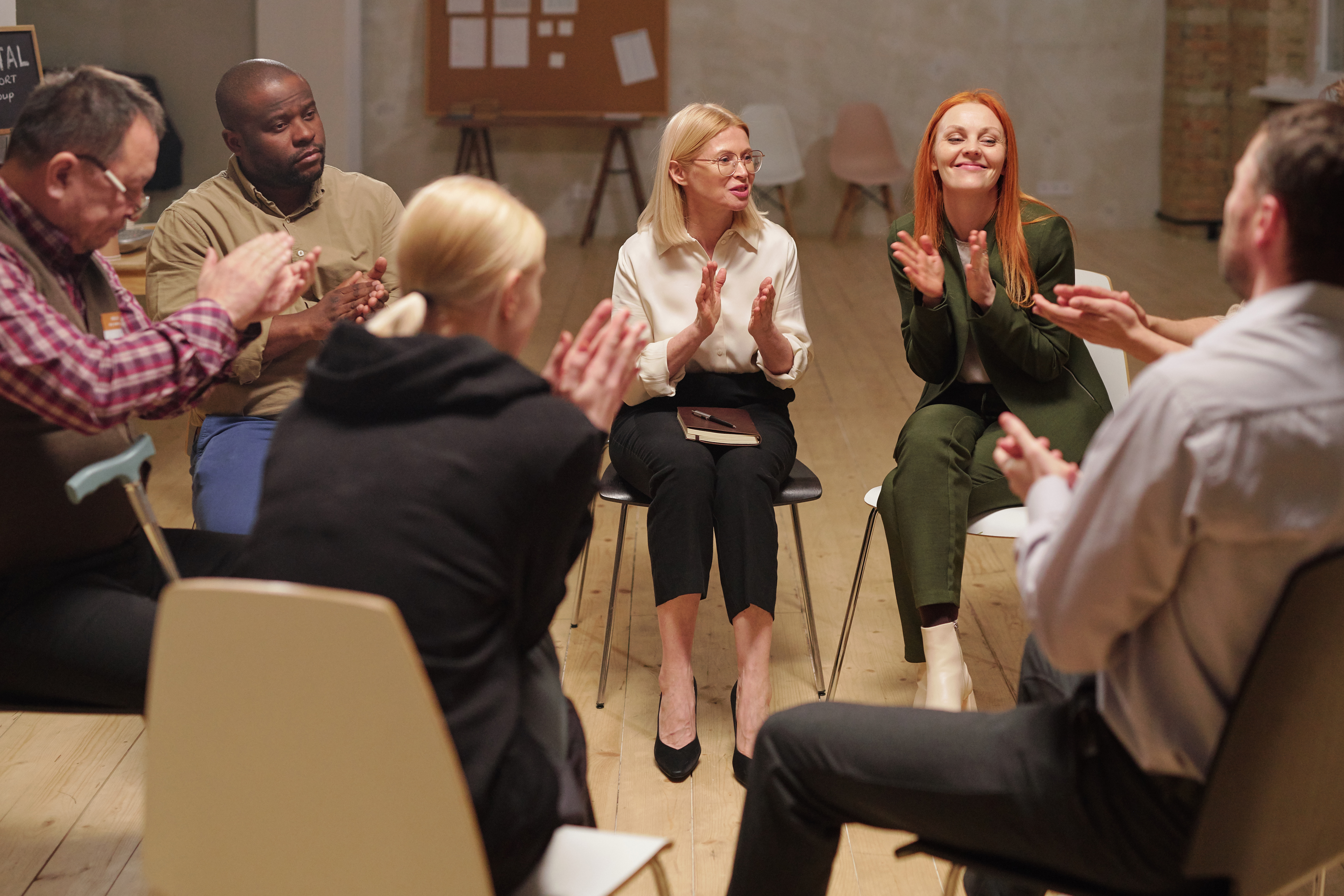 Happy people clapping hands after hot discussion of psychological problems